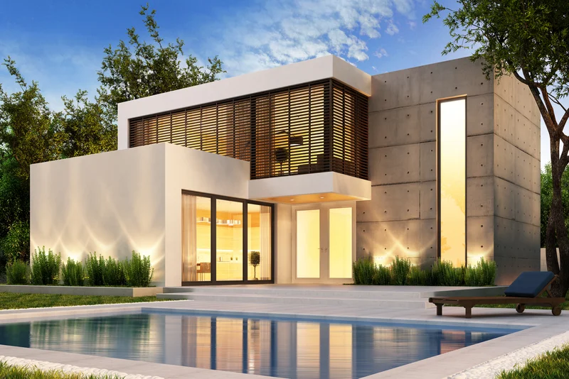 Modern concrete pool deck and patio with luxury home architecture Modern concrete pool deck and patio with luxury home architecture