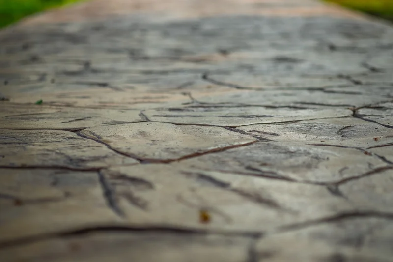 Close-up of decorative stamped concrete stone texture. Close-up of decorative stamped concrete stone texture.