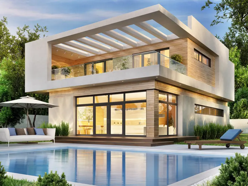 Smooth concrete pool deck surrounds luxury backyard swimming pool Smooth concrete pool deck surrounds luxury backyard swimming pool