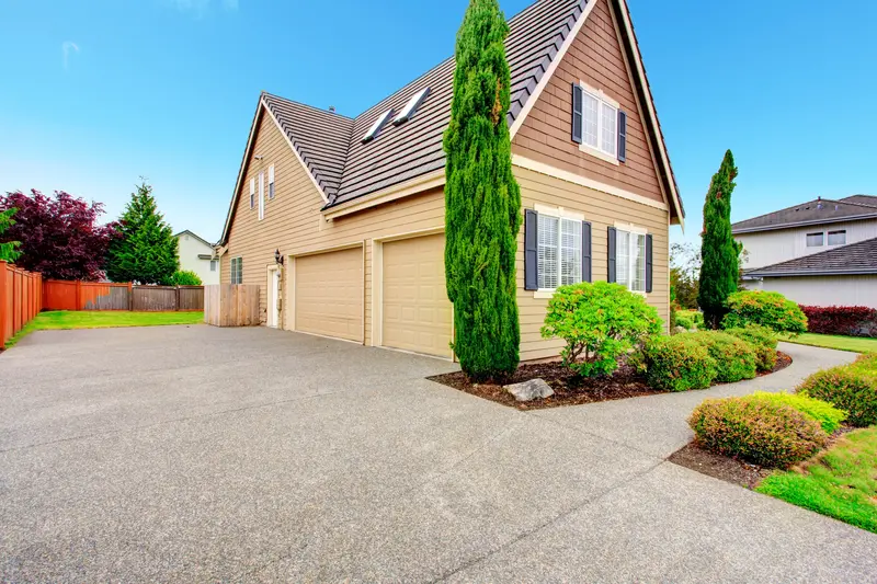 Large concrete driveway installation for suburban home garage Large concrete driveway installation for suburban home garage