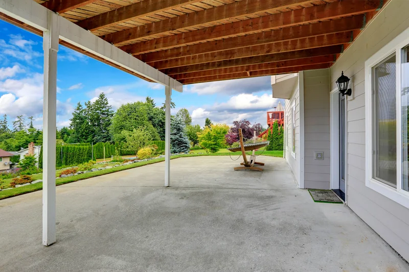 Under-deck concrete patio overlay with a wooden deck above. Under-deck concrete patio overlay with a wooden deck above.
