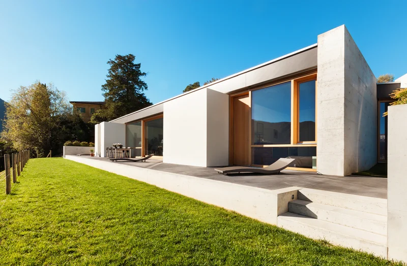 Contemporary concrete walkways and patio stairs next to a lawn. Contemporary concrete walkways and patio stairs next to a lawn.